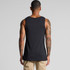 A black singlet worn by a person, featuring a plain design and showing tattooed arms. The back view is visible.