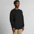 A black jumper featuring a classic design and a logo on the front, modelled by a standing man.