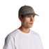 A grey cap accompanied by a plain white t-shirt. The cap features a logo on the front.