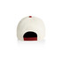 A two-tone cap in cream and burgundy with a rear adjuster and a logo.