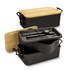 An expandable lunch box in black with a bamboo lid, featuring compartments and utensils inside. It has a logo.