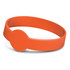 An orange silicone wristband with a debossed design, featuring a circular emblem.