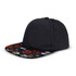 A black flat peak cap featuring a floral pattern on the brim and a branding logo.