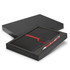 A black notebook with a red band and a silver pen, presented in a black gift box with green interior.