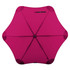 A fuchsia umbrella with a unique star shape and a central button, featuring a black logo.