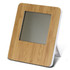 A bamboo-framed weather station with a sleek design and a grey screen, standing on a foldable white support.