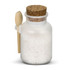 A frosted glass jar filled with white bath salts, topped with a cork lid and a small wooden spoon.