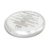 A round, clear travel case containing hand soap ingredients, with a smooth surface and a subtle sheen.
