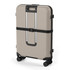 A beige wheeled suitcase with four spinner wheels and a black strap, featuring a minimalist design and a logo.