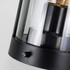 A black keepsake halo lantern with a glass shade and a decorative filament bulb, featuring a control knob at the base.