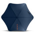 A navy blue sport umbrella with a hexagonal shape and a handle, featuring a logo on one side.