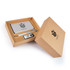 A cardboard gift set featuring a power bank, a USB flash drive, and a pen, all displayed elegantly in a brown box.