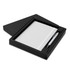 A black gift box containing a white notebook and a silver pen. The set is elegantly presented for gifting.