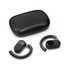A pair of black Loop Ear Buds beside a sleek black charging case.