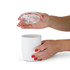 A white coffee cup with a clear lid, held by two hands with red manicured nails.