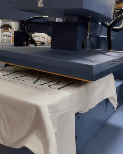 Heat transfer press applying a full-colour transfer to a garment