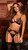 geometric black lace bra set features a v-neckline, sheer lace underwire cups with bust cutouts, a strappy back with multiple hook closures, matching garter belt with adjustable garters, and a matching thong