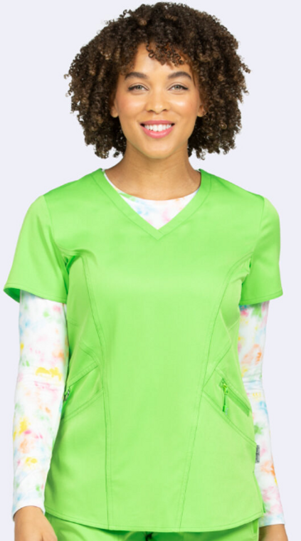 woman smiling in wine scrub top