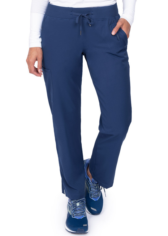 woman’s legs in wine scrub pants