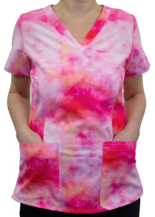 Medical professional wearing a pink and orange tie-dye scrub shirt