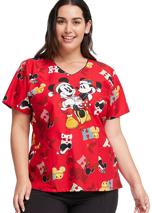 Medical professional wearing a red holiday Minnie and Mickey Mouse scrub top