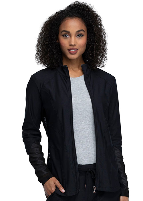 Medical professional wearing a black zip-up scrub jacket