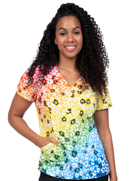 Medical professional wearing a rainbow leopard print scrub shirt