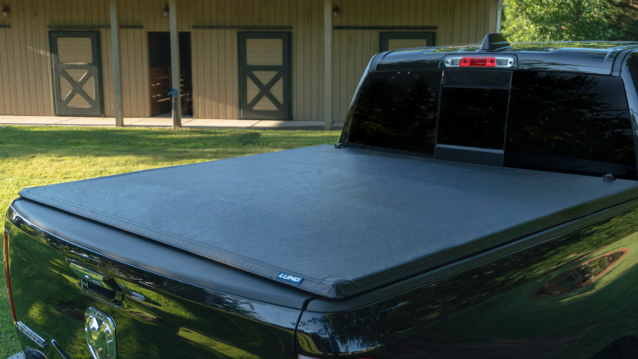 Lund 04-14 Ford F-150 (5.5ft. Bed) Genesis Tri-Fold Tonneau Cover - Black - 95072 Photo - Mounted