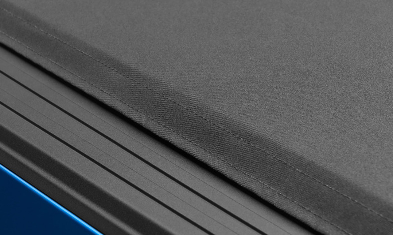 Lund 04-18 Ford F-150 (6.5ft. Bed) Genesis Elite Roll Up Tonneau Cover - Black - 96873 Photo - Close Up