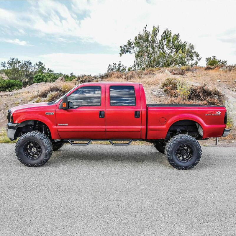 Westin 1999-2016 Ford F-250/F-350/F-450/F-550 Crew Cab Outlaw Drop Nerf Step Bars Textured Black - 20-11335 Photo - Mounted