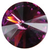 Round purple February crystal gemstone with a faceted cut design and reflective surface, shown individually and displayed as an accent option on a memorial paw print keepsake.

