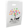 White die-cut handle paper bag featuring a colorful paw print tree with dog and cat silhouettes.

