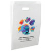 White die-cut handle paper bag featuring a colorful watercolor-style paw print with paint splash accents.