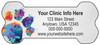 Bone-shaped veterinary die-cut magnet featuring a colorful paint splatter paw print on the left side with personalized clinic information on a gray background.

