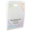 White die-cut handle paper bag featuring a rainbow-colored border of paw prints surrounding an open center area.

