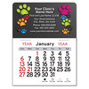 Mini calendar with colorful paw prints in green, pink, orange, blue, and black surrounding a customizable veterinary clinic imprint area on a dark background.

