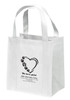 Reusable non-woven tote bag with paw prints forming a heart outline and “We love pets!” text above clinic information layout.