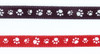 Black memorial ribbon with white paw print pattern and red ribbon with white paw prints both for ClayPaws keepsakes and pet remembrance displays.