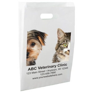 White die-cut handle paper bag featuring close-up photographic portraits of a dog and cat positioned on opposite sides above veterinary clinic information.

