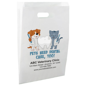 White die-cut handle paper bag featuring illustrated dog and cat dental characters holding toothbrushes beside a tooth graphic and the message "PETS NEED DENTAL CARE, TOO!"

