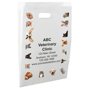 White die-cut handle paper bag featuring a border of dog and cat photographs surrounding a central clinic information area.

