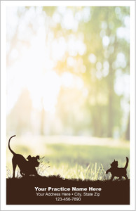 Half-size veterinary notepad featuring dog and cat silhouettes in a grassy foreground with a blurred outdoor scene and trees in the background.

