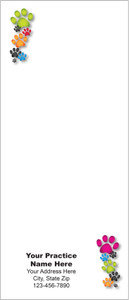 Tall veterinary notepad featuring colorful paw prints in green, pink, orange, blue, and black positioned in opposite corners with a large writing area.

