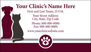 Veterinary business card featuring burgundy dog and dark gray cat silhouettes with a paw print medical emblem and centered contact information.

