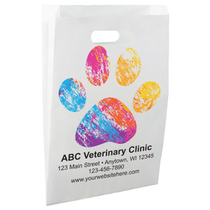 White die-cut handle paper bag featuring a large multicolored paint-style paw print design.

