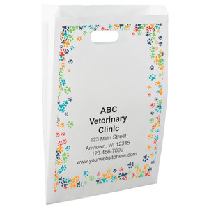 White die-cut handle paper bag featuring a colorful border of blue, green, orange, red, and navy paw prints.


