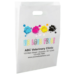 White die-cut handle paper bag featuring colorful paw prints with paint splash accents and the phrase "WE LOVE PETS!"

