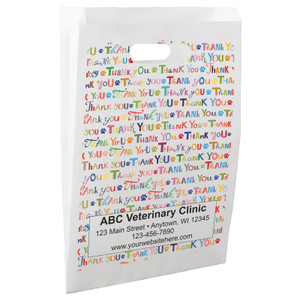 White die-cut handle paper bag featuring a colorful repeating Thank You typography pattern with paw print accents.

