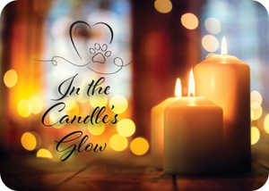 Front shows “In the Candle's Glow” with three lit candles and a heart-shaped paw print graphic; back displays a memorial poem by Laura Hickman on a candlelit background.


