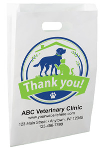White die-cut handle paper bag featuring a dog and cat beneath a house roof inside a circular badge with a Thank You banner.